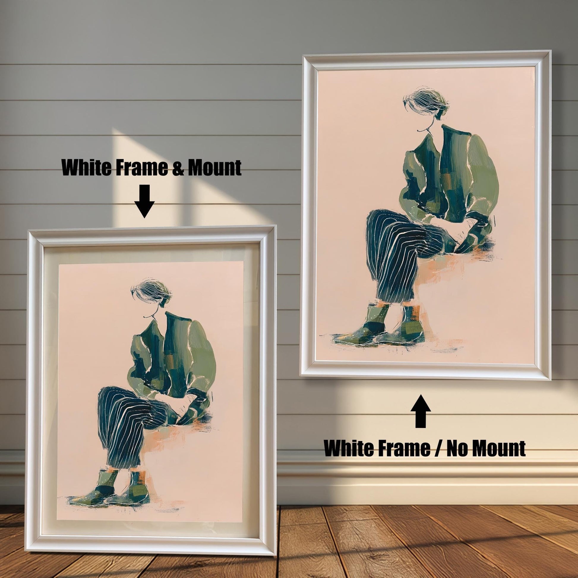 Comparison of the art print in a White wood frame: Left is "White Frame & Mount" with a light matting, and Right is "White Frame / No Mount" without matting. The artwork features a figure seated in green and dark striped clothing on a light pink background.