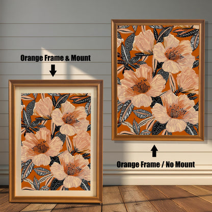 Comparison of the floral art print in an Orange wood frame: Left is "Orange Frame & Mount" with a light matting, and Right is "Orange Frame / No Mount" without matting.