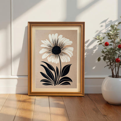 Lifestyle photo of the art print in an Orange wood frame with a mat/mount, leaning on the floor against a white wall next to a small potted plant.