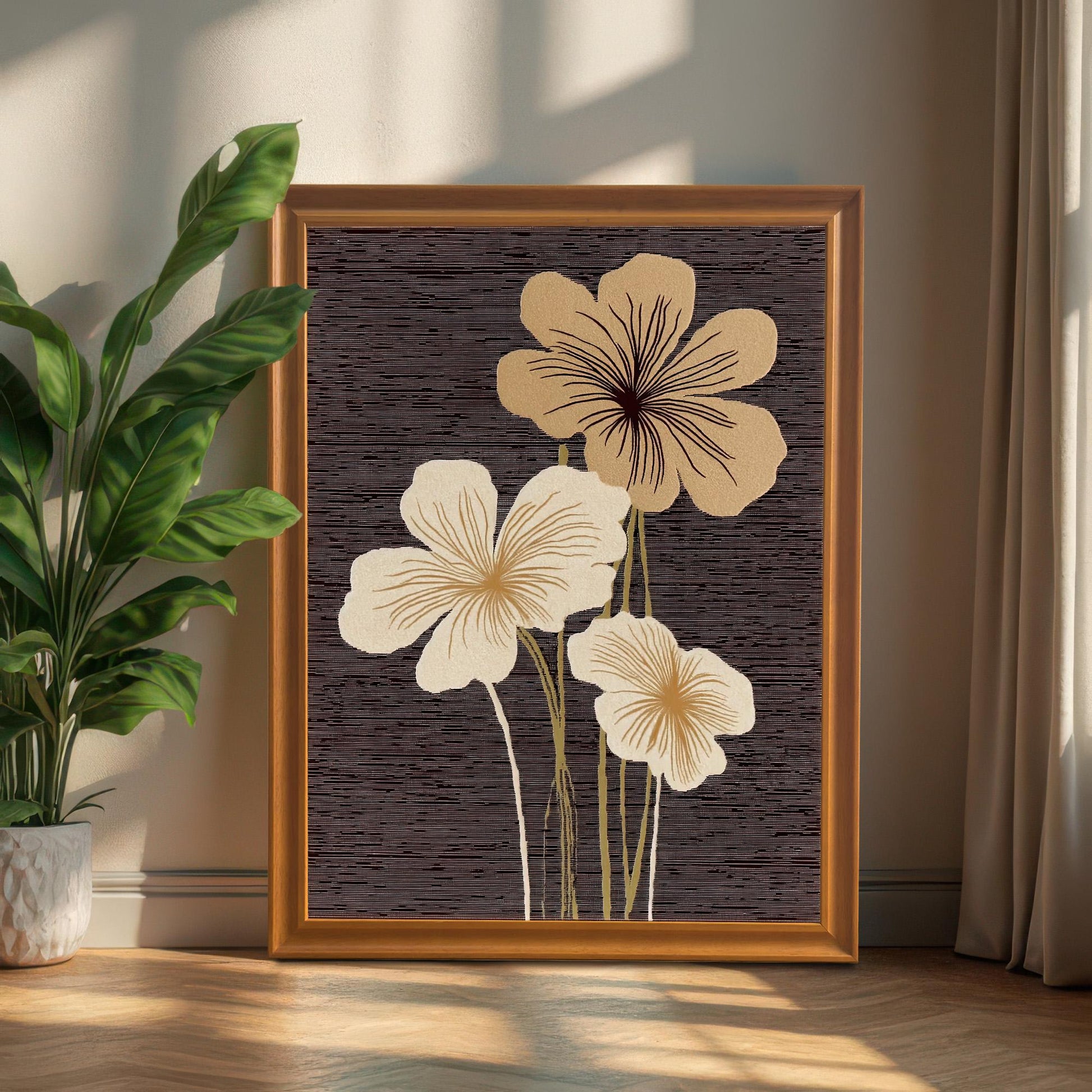 A portrait-oriented abstract floral art print in an Orange/Wood-tone frame leaning on the floor against a wall, next to a large potted green plant and curtain.