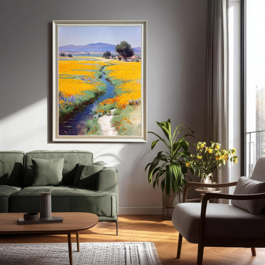 Large framed art print (appears to be a White or Silver Frame) hanging on a gray wall in a modern living room setting over a green sofa, illuminated by sunlight from a nearby window.