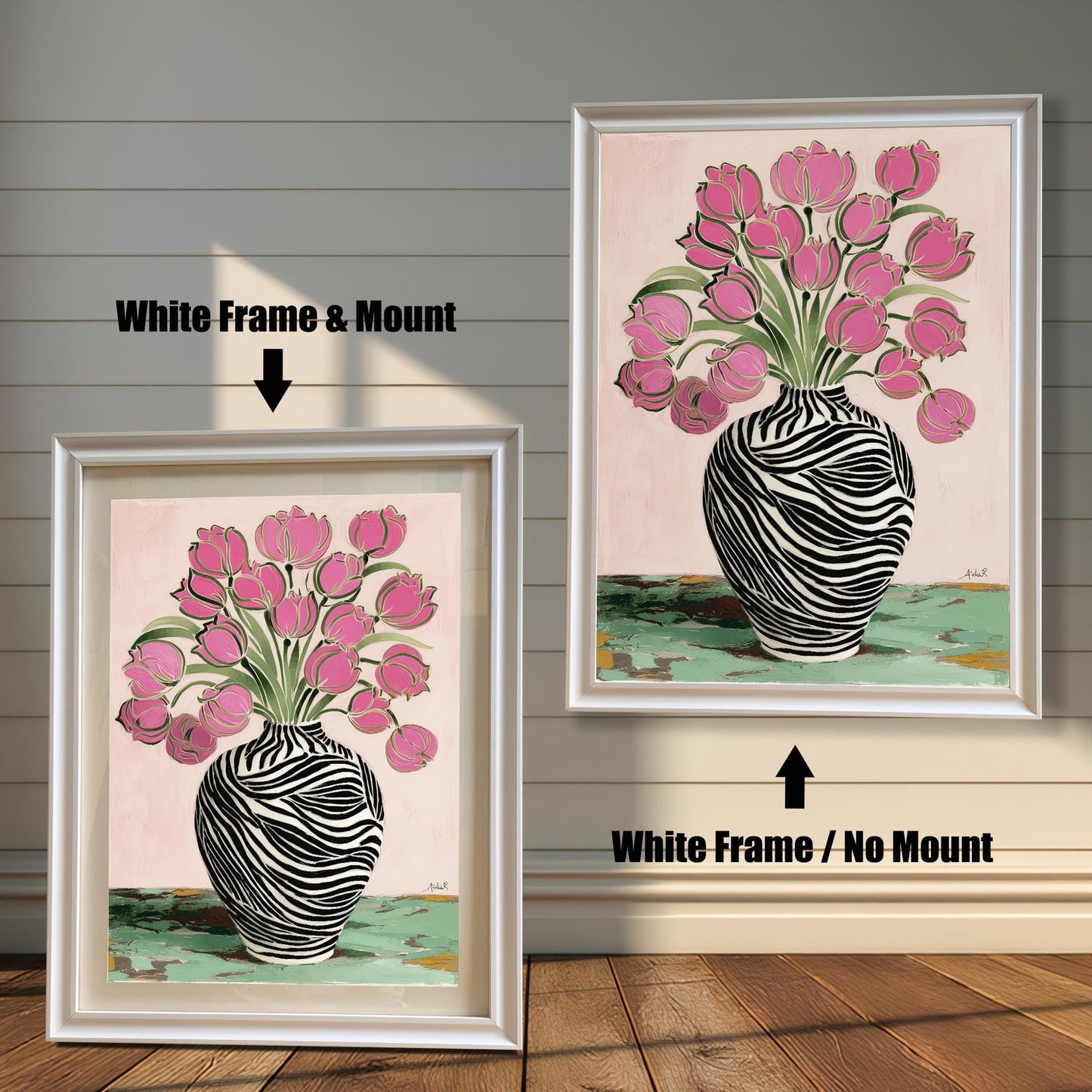 Zebra Vase and Pink Tulips art print shown in two white wood frames on a rustic wood panel wall. The left frame includes a mount/mat, and the right frame shows the print without a mount/mat.