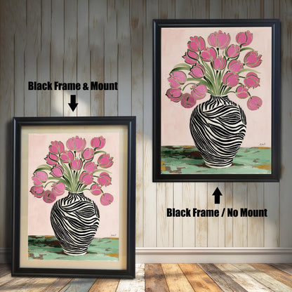 Zebra Vase and Pink Tulips art print shown in two black wood frames on a rustic wood panel wall. The left frame includes a mount/mat, and the right frame shows the print without a mount/mat.