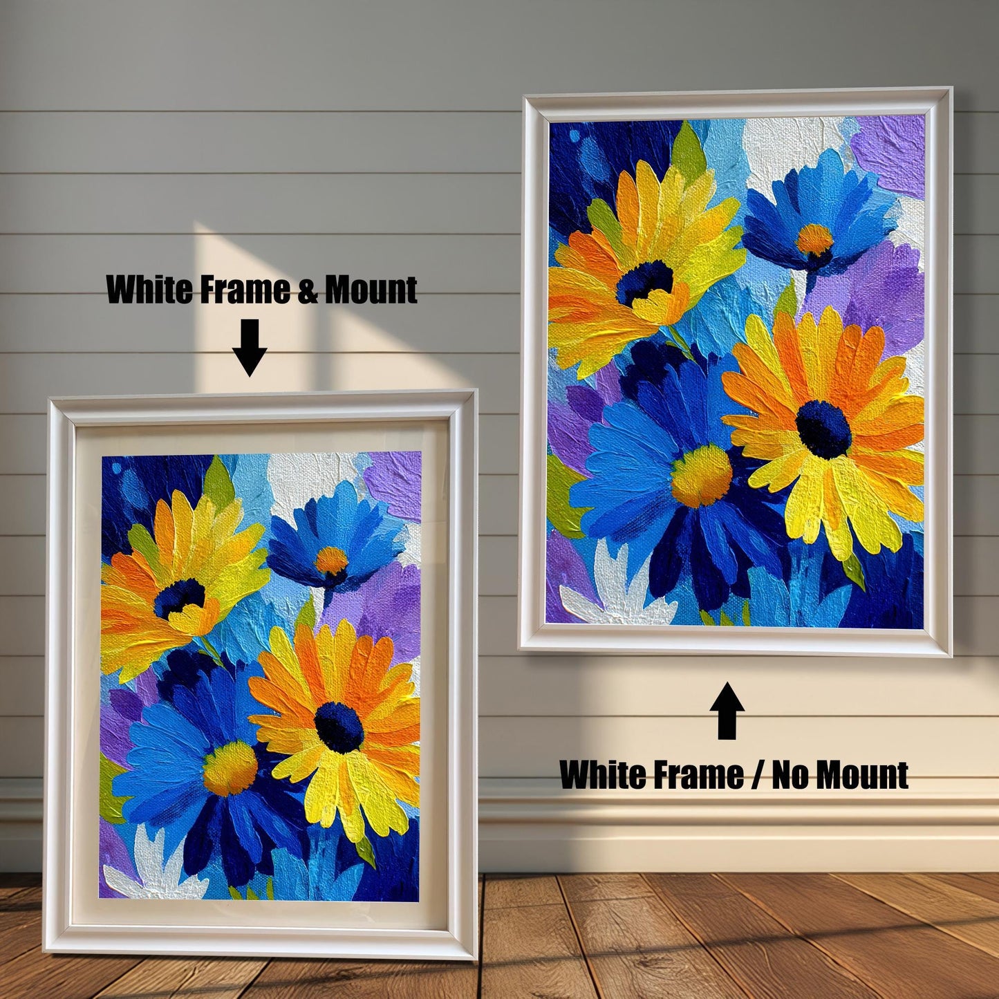 Abstract Blue and Yellow Daisy painting print in two white wood frames on a rustic wall. The left frame includes a mount/mat, and the right frame shows the print without a mount/mat.