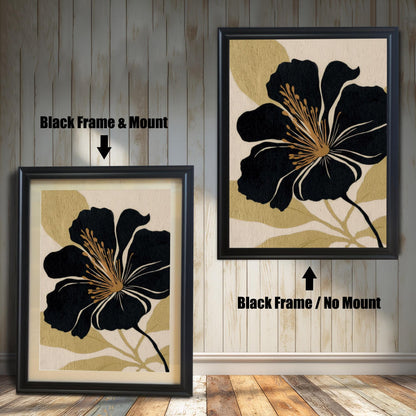 A comparison of two black and gold floral prints against a white wood-paneled wall: one in a Black Frame & Mount (matting), and the other in a Black Frame / No Mount (no matting).