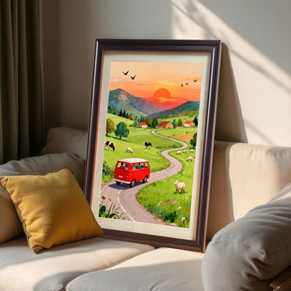 A framed print of the red van countryside scene leaning against a cream-colored sofa with a yellow pillow. The frame is a dark Coffee color, showing a cozy, sunlit interior display.