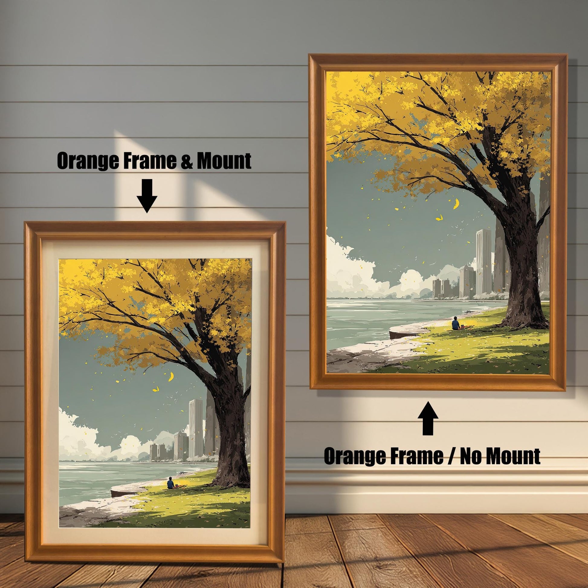 Yellow autumn tree art print comparison showing two framing options: Orange Frame & Mount (light brown/gold frame with a cream border) and Orange Frame / No Mount. The peaceful, minimalist scene features a city park.