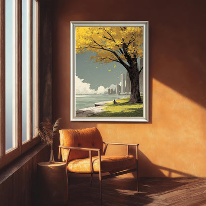Full view of a minimalist framed art print showing a lone tree with yellow fall leaves overlooking a waterfront city skyline. The print is in a white frame in a sunny room with a bright orange wall and a leather armchair.