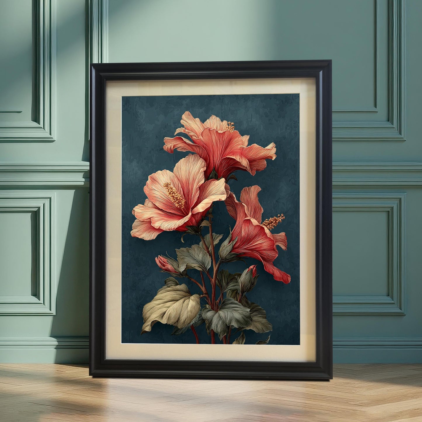 A vertically framed art print with a Black wood frame and a mount (matting), leaning on a teal/dusty green wainscoted wall and light wood floor. The print shows a striking hibiscus botanical illustration with coral and teal colors.
