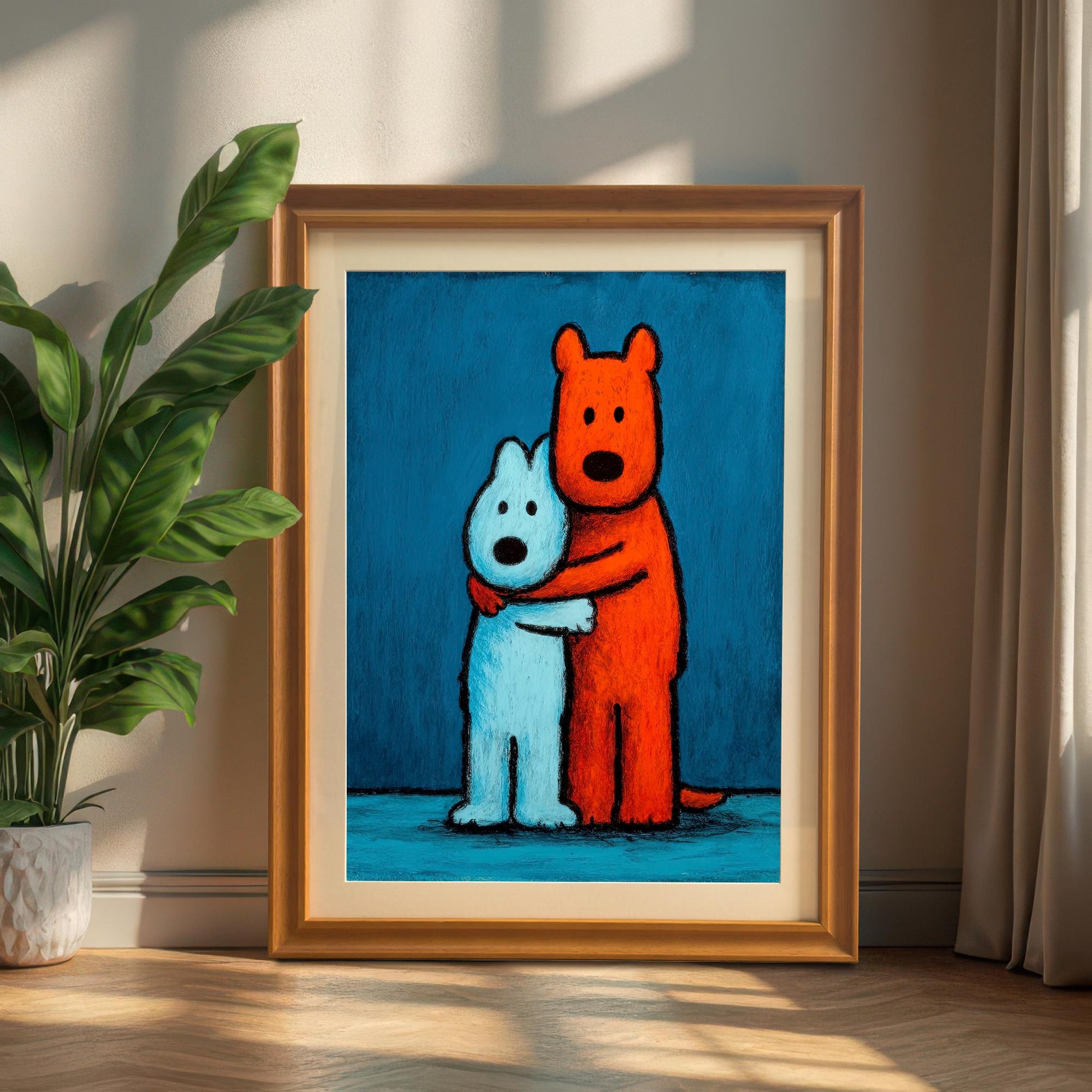 Charming framed art print of two hugging dogs in an orange/gold wood frame with a mat/mount, leaning on the floor next to a large potted houseplant and light curtains.