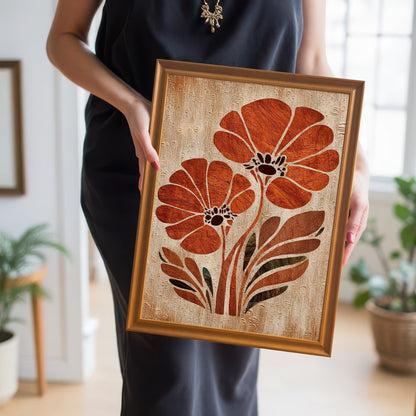 A woman in a black dress holds the orange flower art print in an Orange Wood Frame up close, showing the scale and detail of the artwork.