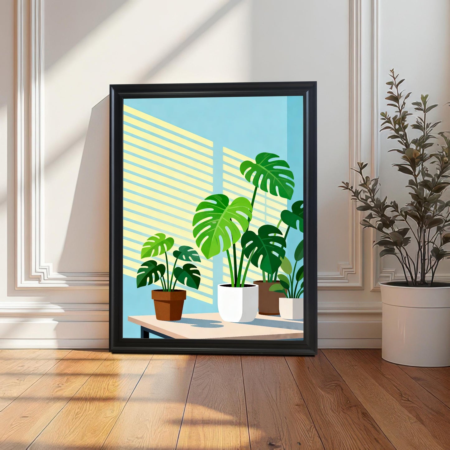 The framed 'Monstera Plants' art print leaning on a light wooden floor against a white paneled wall. The frame is Black. Strong sunlight casts sharp geometric shadows from a nearby window across the wall and floor. A large potted plant is visible on the right.