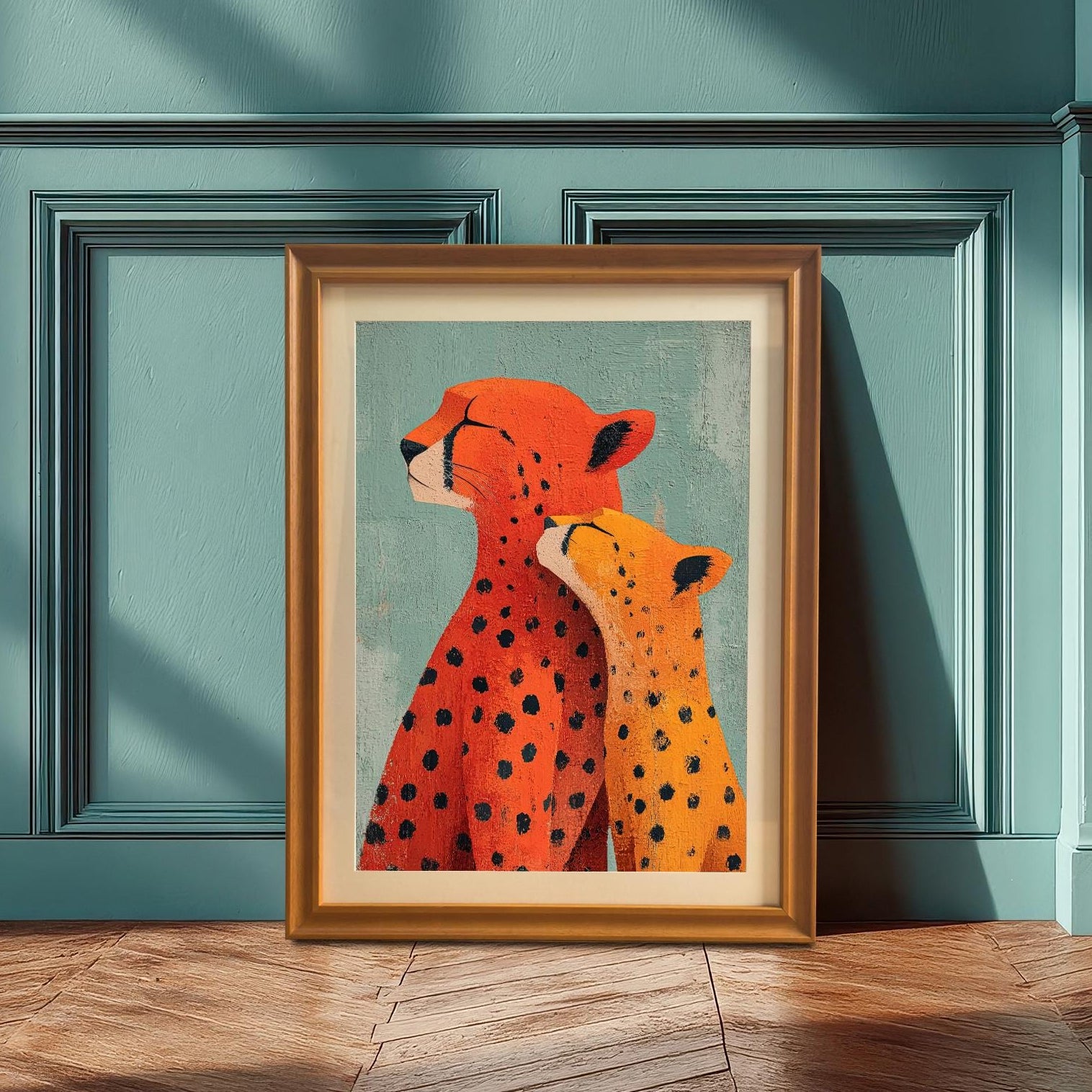 A single framed 'Cheetah Love' art print in an Orange Frame leaning on a wooden floor against a paneled teal/blue wall, illuminated by diagonal sunlight.