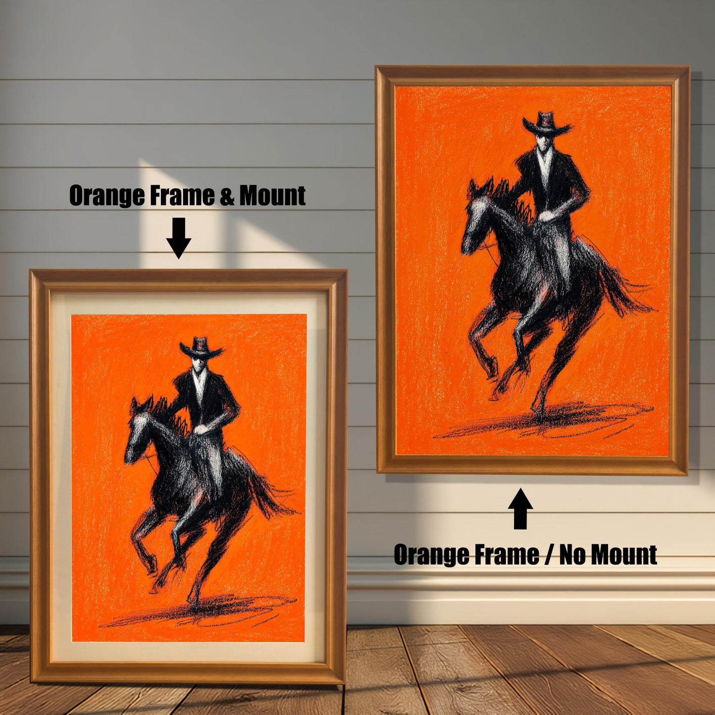 Close-up view of a framed art print featuring a striking black charcoal sketch of a cowboy riding a horse against a bright orange background. The image shows two frame options: an Orange (light brown/golden) colored wood frame with a mount (matting) and an Orange wood frame with no mount around the print.