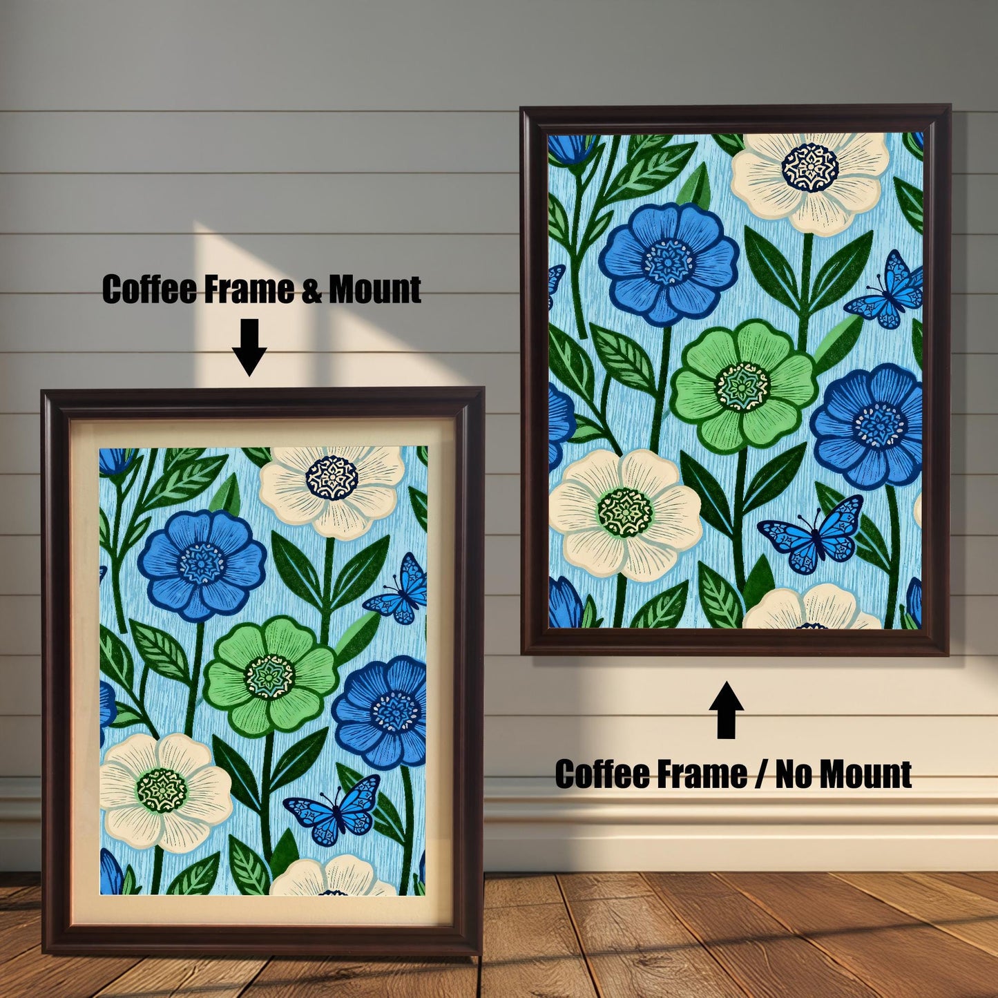 Comparison image showing a dark brown Coffee framed art print with a light-colored mount (mat) on the left, and a Coffee framed art print without a mount on the right. Both prints feature a repeating pattern of blue, green, and cream flowers with blue butterflies on a light blue, wood-grain textured background.