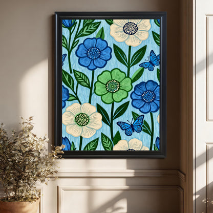 A large Black framed art print featuring the blue and green floral pattern artwork, hanging on a beige wall in a stylish room corner next to a potted plant.