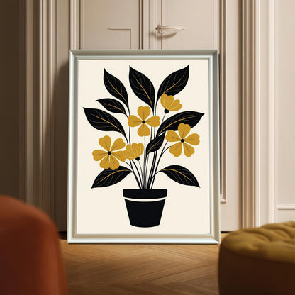 Full-view mock-up of the abstract yellow and black potted plant art print displayed in a White or Silver frame (appears silver/light gray in this image), leaning on the floor against a cream door or cabinet.