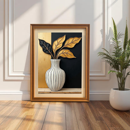 Framed black and gold leaf art print leaning on a wood floor against a white wall with wainscoting. The frame is a gold/orange wood color. A snake plant in a white pot is on the right.