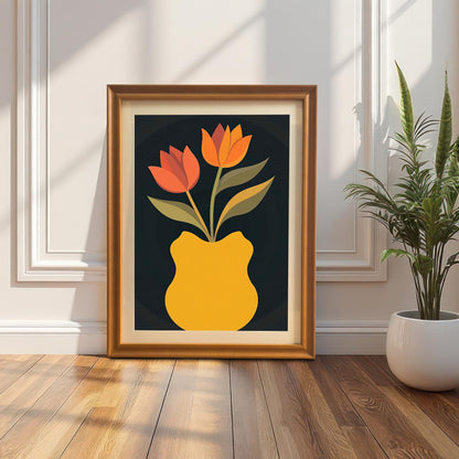 Framed art print of orange and red tulips in a yellow vase, leaning on a wood floor against a white wall with wainscoting. The frame is a gold/orange wood color. Natural light casts strong shadows.
