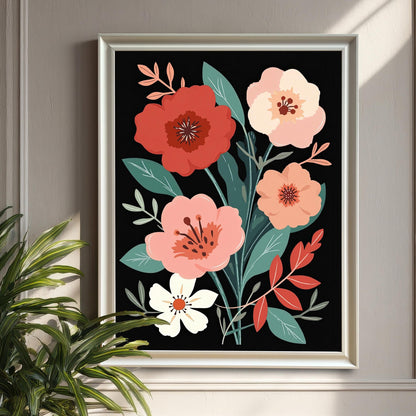 White-framed floral art print hanging on a gray-paneled wall, with a green houseplant to the left. Sunlight casts a shadow on the wall.