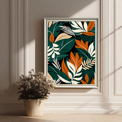 Styled image of the tropical leaf art print framed in White on a panelled, off-white wall. Sunlight casts shadows, and a dried floral arrangement in a pot is in the foreground.