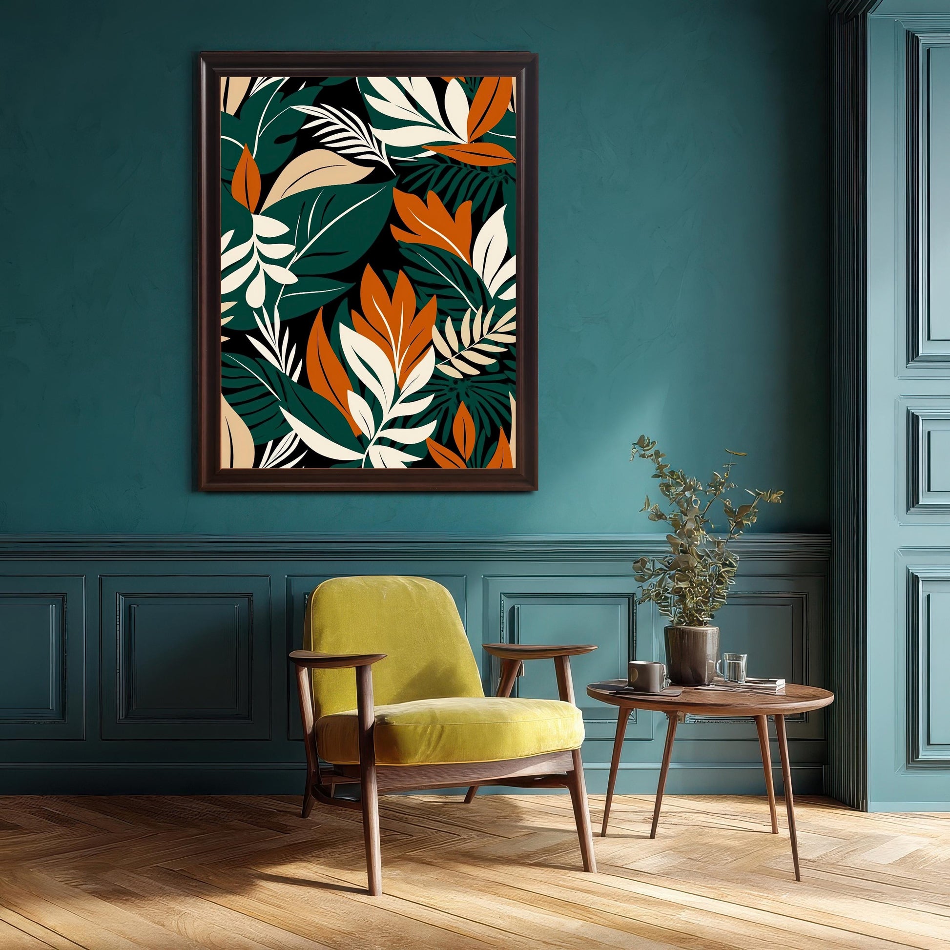 Abstract tropical leaf art print in a Coffee/Dark Wood frame hanging on a rich, deep teal wall above a retro lime-green armchair. The room features wainscoting and hardwood floors.