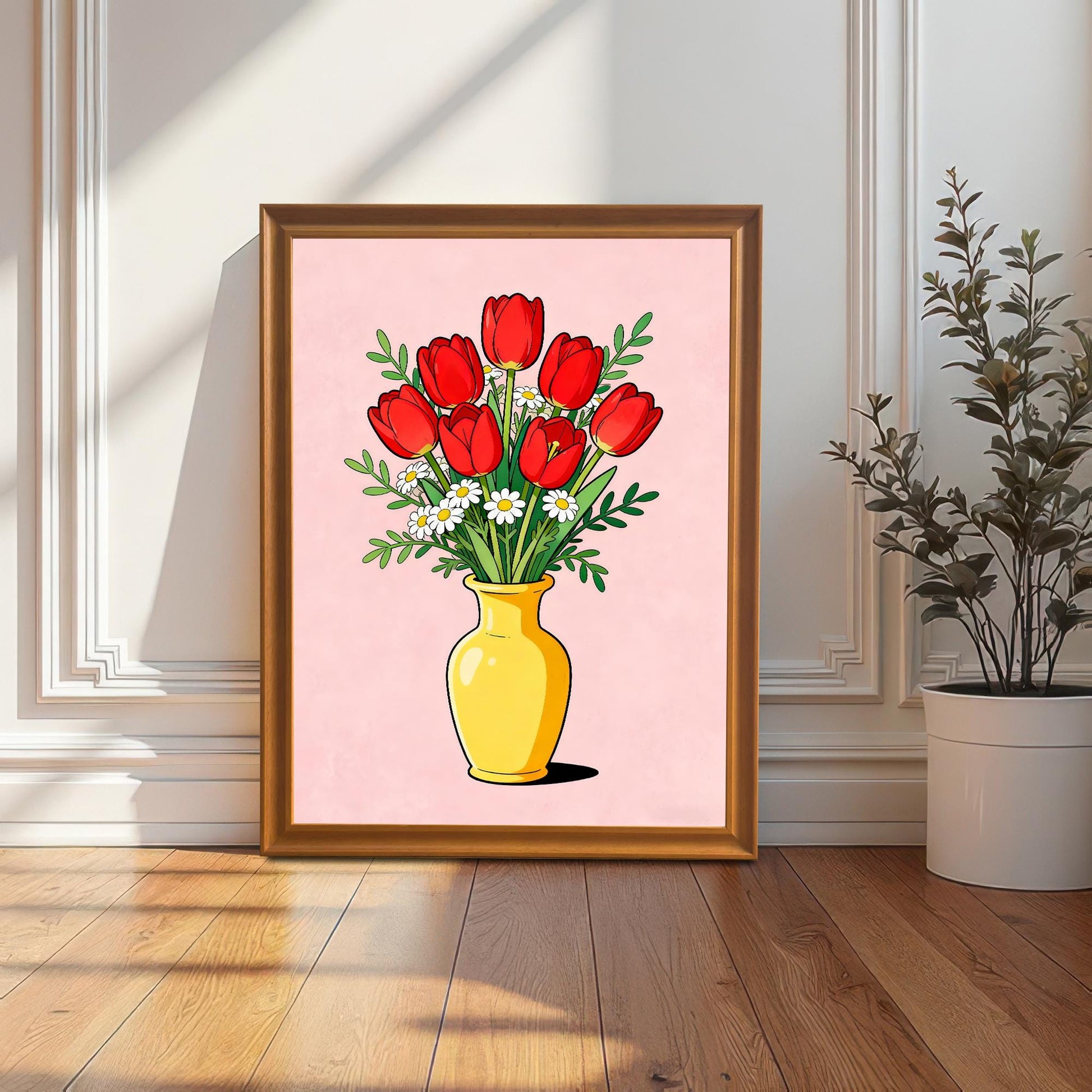 A large framed print of red tulips and daisies in a yellow vase, displayed in an Orange (light brown/gold-toned wood) frame. The art is leaning against a white wainscoted wall next to a potted plant, with sunlight streaming in.