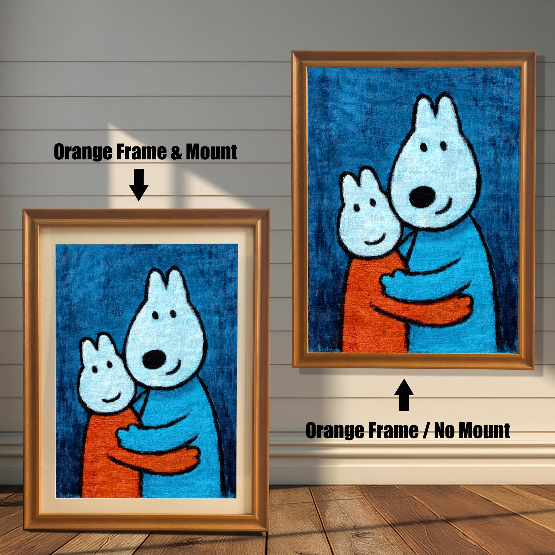 Comparison of an Orange wood frame with a cream mount (mat) on the left, and an Orange wood frame without a mount on the right, both featuring the print of two hugging cartoon animals.