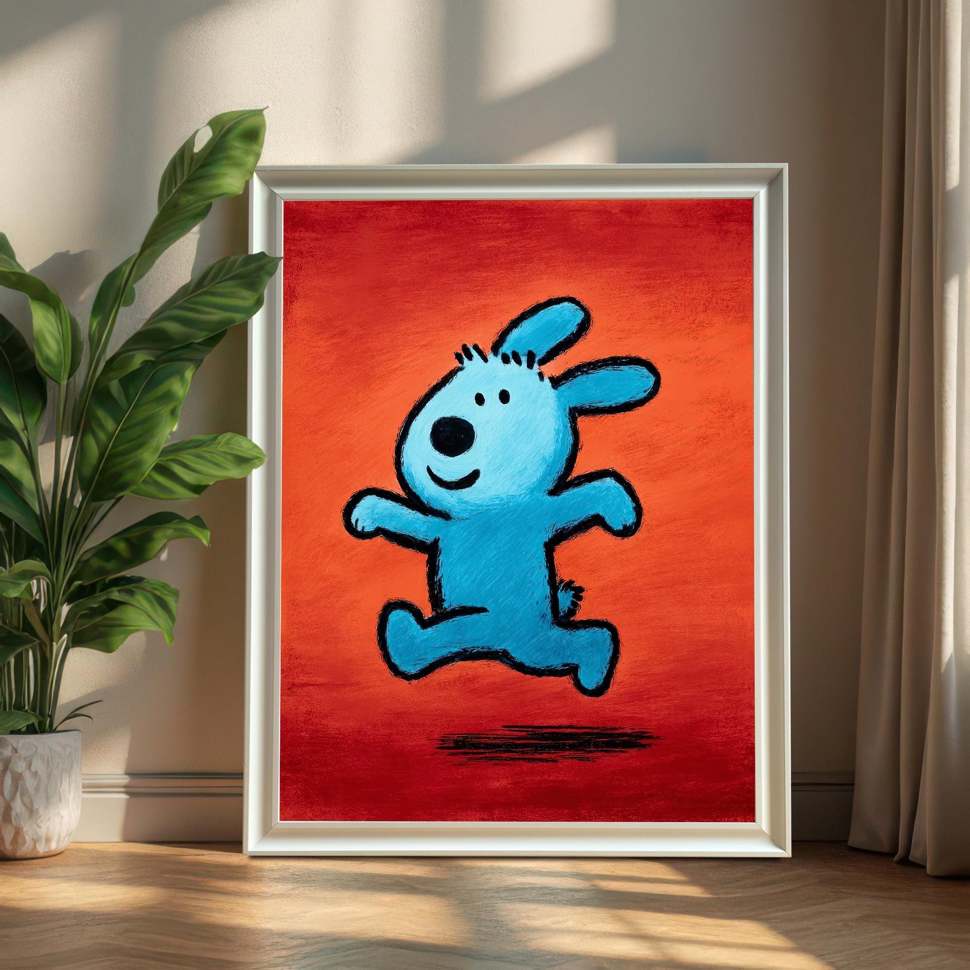 Full view of the framed pop art print of the blue running animal with a White Frame (No Mount), leaning against a wall next to a large potted plant and window curtains, with strong sunlight.