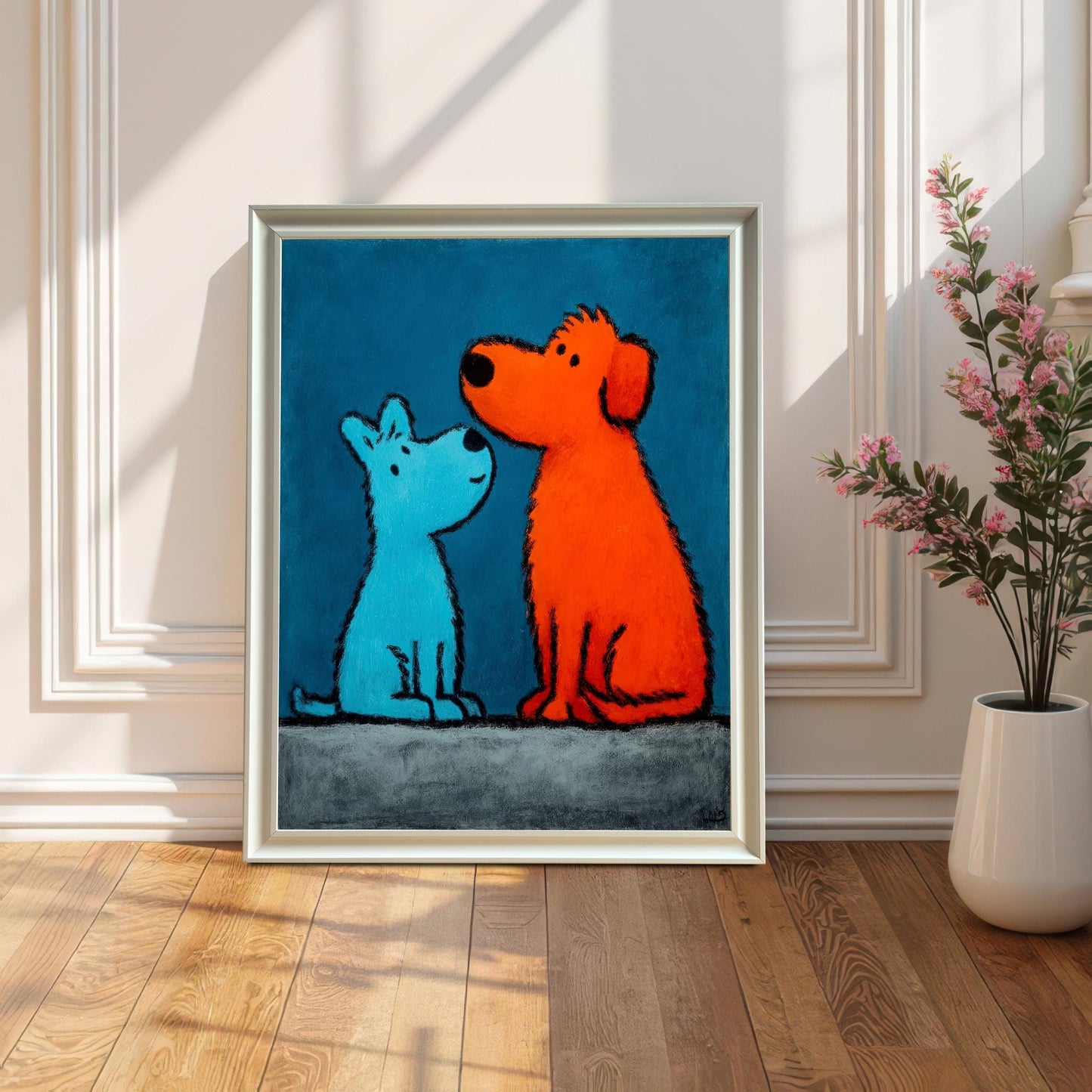 Full view of the pop art style painting featuring a small blue dog and a large orange dog in a White Frame (No Mount). The framed print is leaning on a wood floor against a white paneled wall, with sunlight casting sharp shadows. A vase with a pink floral arrangement is to the right.