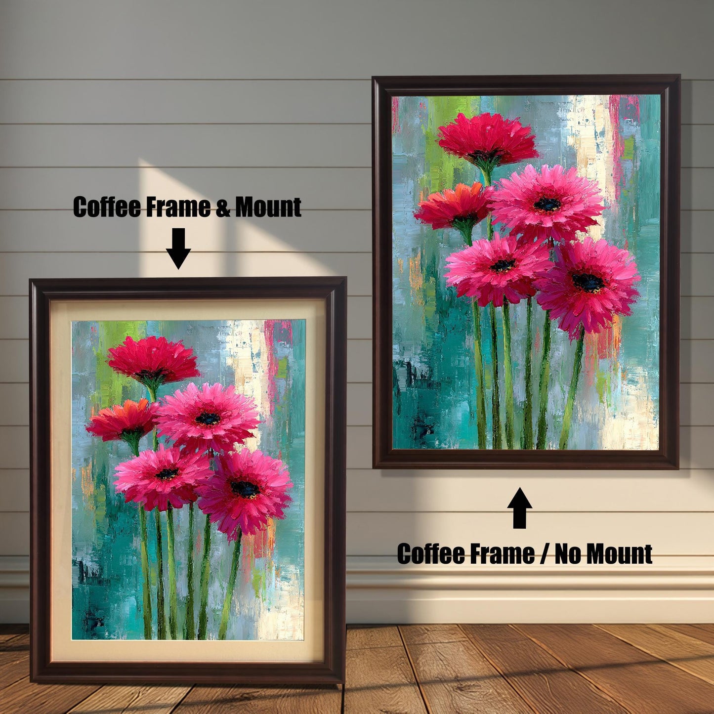 Abstract floral painting of bright pink flowers in two options: a Coffee Frame & Mount (with a light border/mat) on the left, and a Coffee Frame / No Mount (full print to the frame edge) on the right. Both hang on a wood-paneled wall.