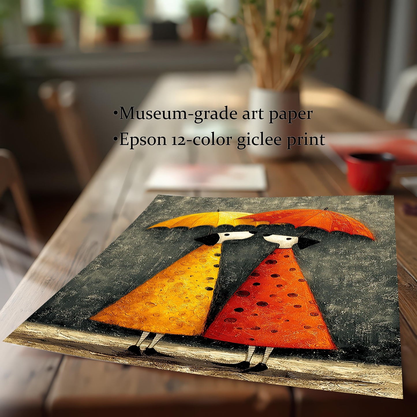 A close-up, angled shot of the umbrella couple art print on a wooden table. Text describes the print quality as Museum-grade art paper and an Epson 12-color giclee print.