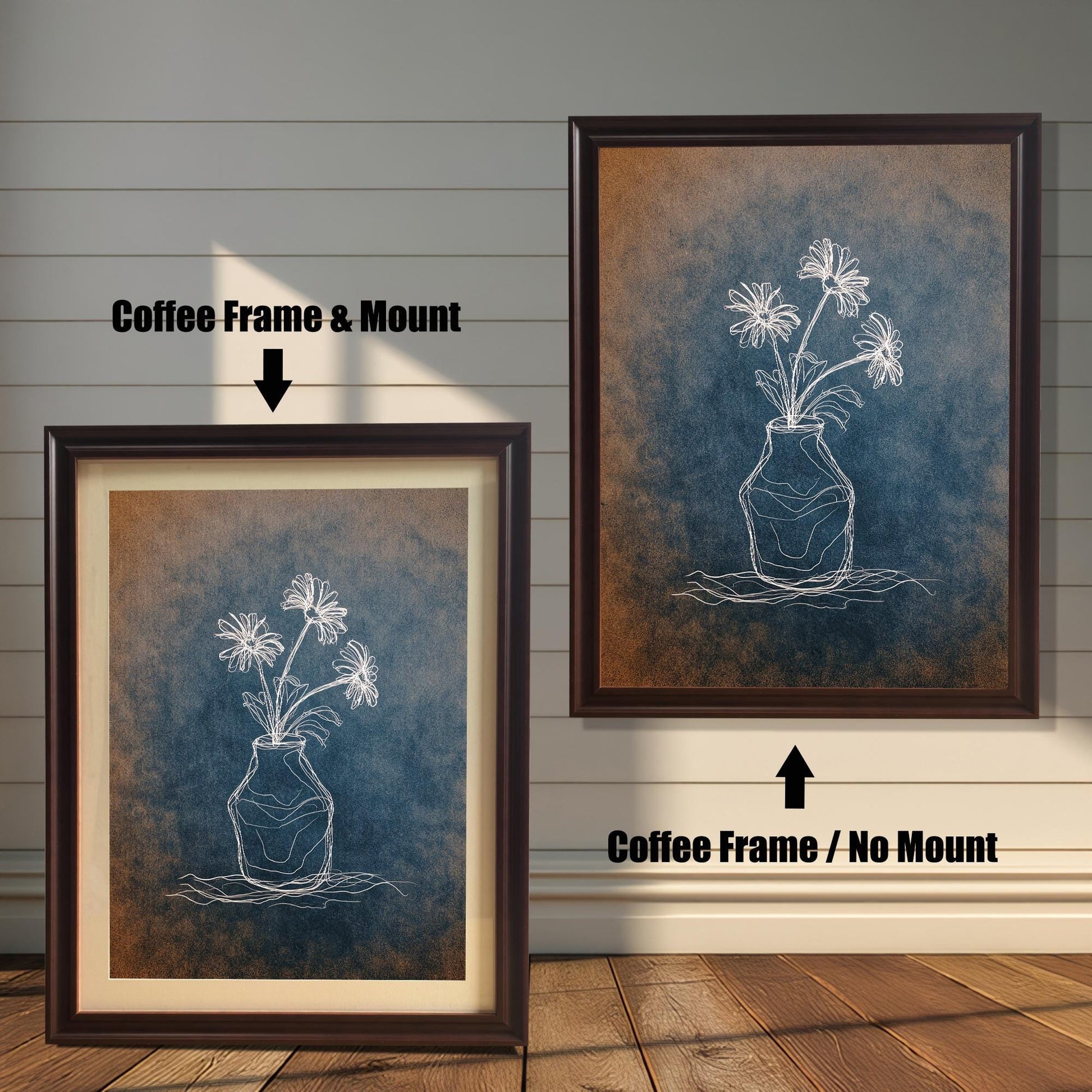 Comparison image showing two dark brown framed art prints. The left print is a Coffee Frame & Mount (with a mat board), and the right print is a Coffee Frame / No Mount. The art is a white chalk-style flower drawing on a blue and rust-colored textured background.