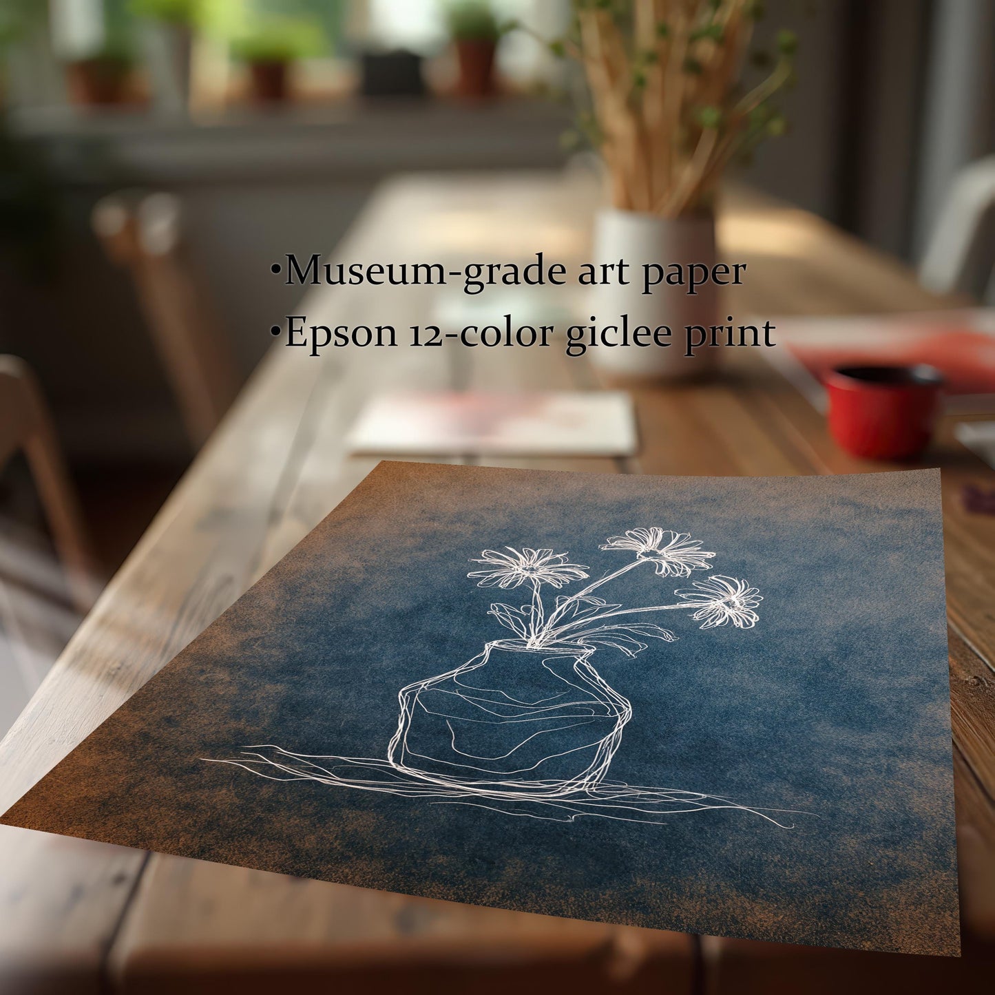 Close-up of the chalk flower print lying on a wooden table. Text overlay lists product features: ""Museum-grade art paper"" and ""Epson 12-color giclee print."" The print shows a white line drawing of flowers on a distressed blue and orange surface.