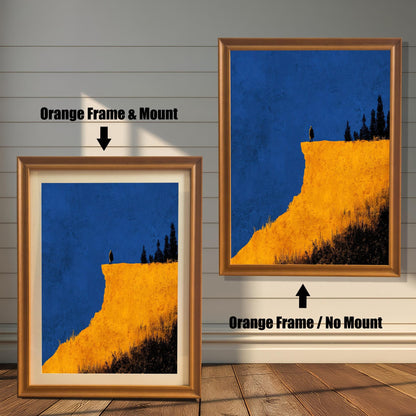 Comparison image showing the Orange wood frame options: on the left, a framed cliff print with a mount/mat; on the right, the print in an Orange frame with no mount. Both on a white paneled wooden wall background.