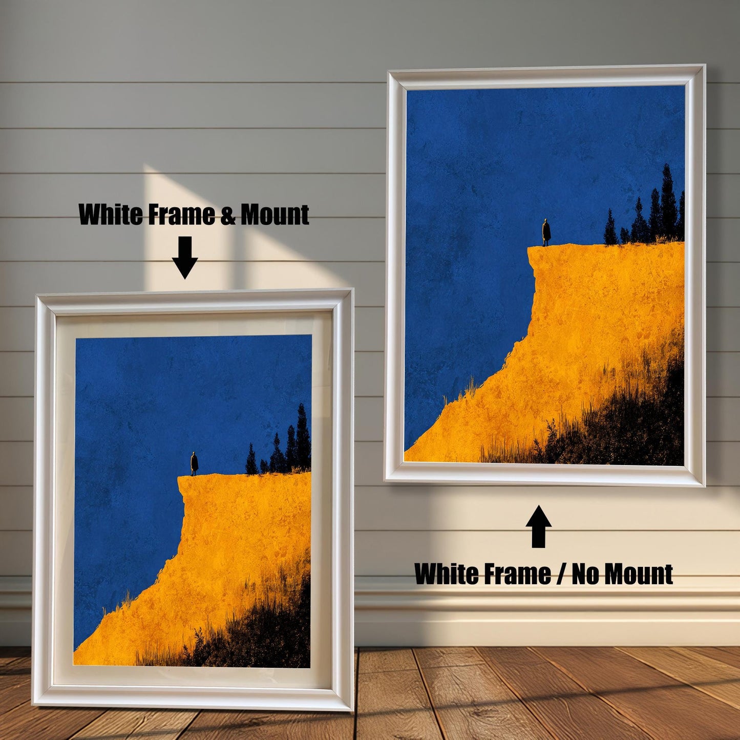 Comparison image showing the White frame options: on the left, a framed cliff print with a mount/mat; on the right, the print in a white frame with no mount. Both on a white paneled wooden wall background.