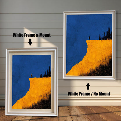Comparison image showing the White frame options: on the left, a framed cliff print with a mount/mat; on the right, the print in a white frame with no mount. Both on a white paneled wooden wall background.