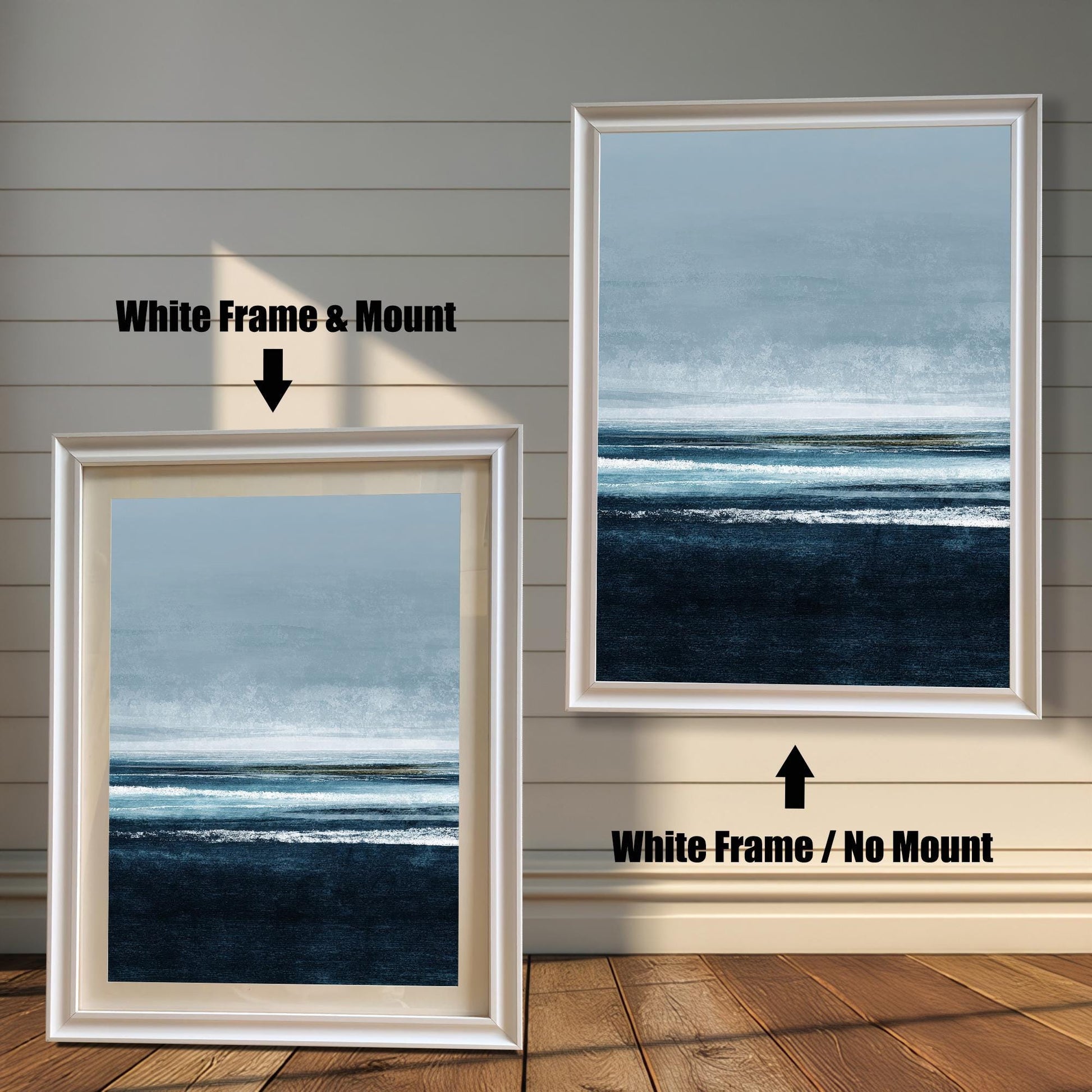 Comparison image showing the White frame options: on the left, a framed seascape print with a mount/mat; on the right, the print in a white frame with no mount. Both on a white paneled wooden wall background.