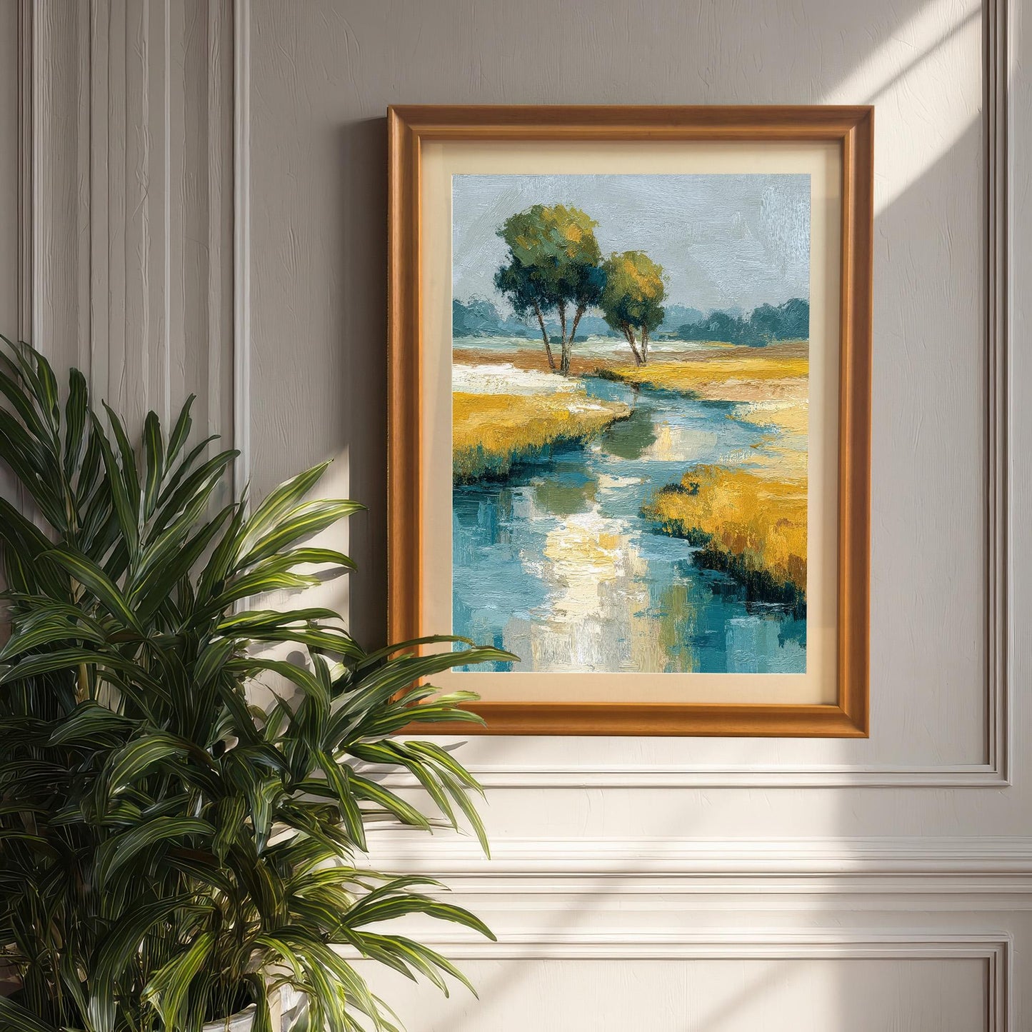 A framed art print of the abstract landscape painting, hanging on a white paneled wall. The frame is Orange/Gold wood and includes a mount/border. A large potted plant is visible in the foreground on the left.