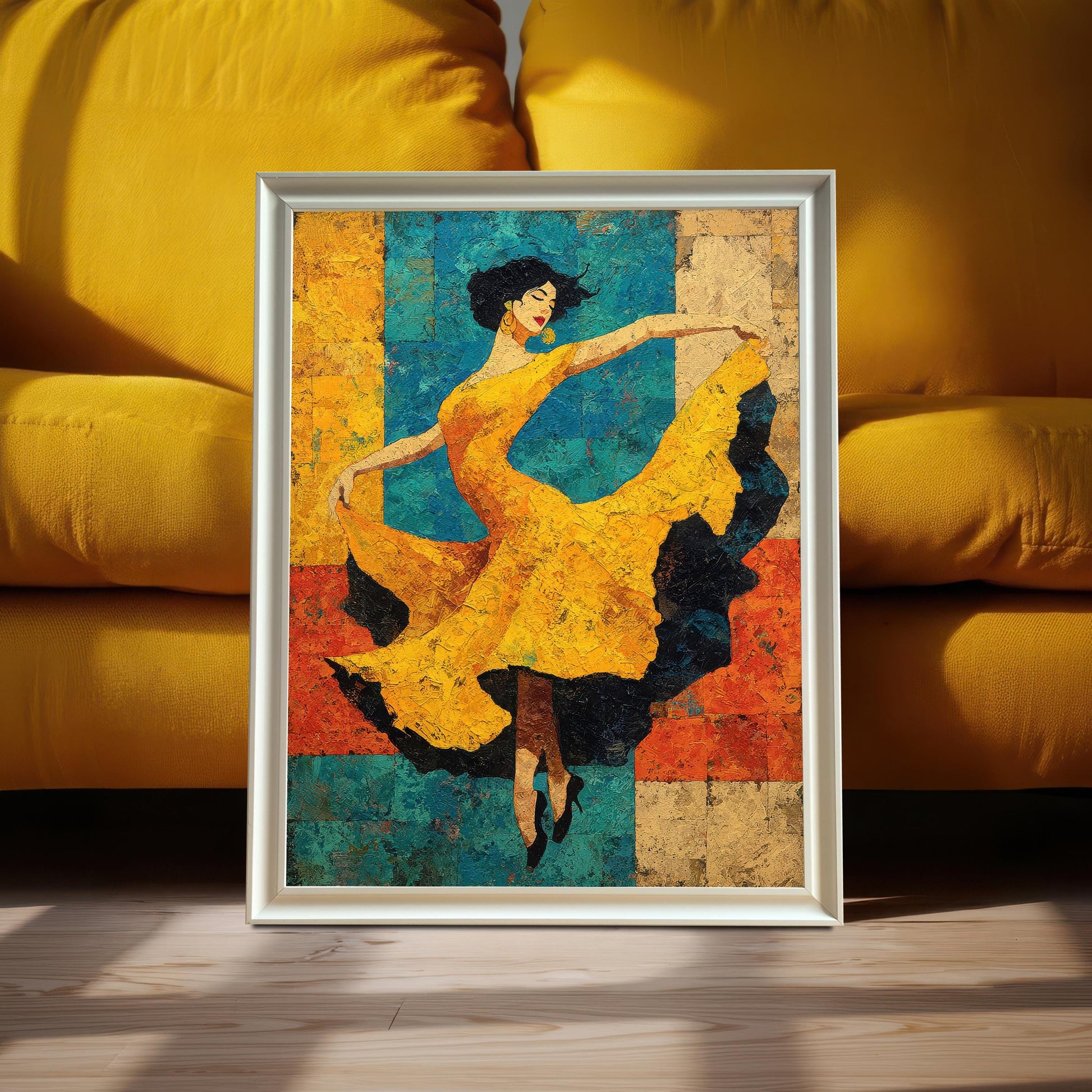 A framed art print of a dancer in a yellow dress, set in a White/Silver Frame. The print is propped on the floor in front of a bright yellow cushioned sofa.