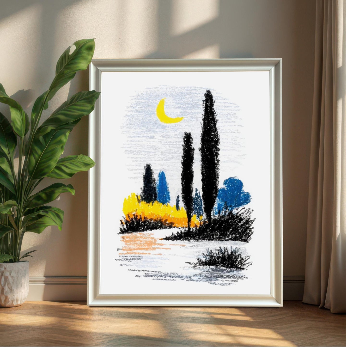 A large, framed abstract landscape print in a simple white frame, leaning against a neutral wall next to a potted green plant.