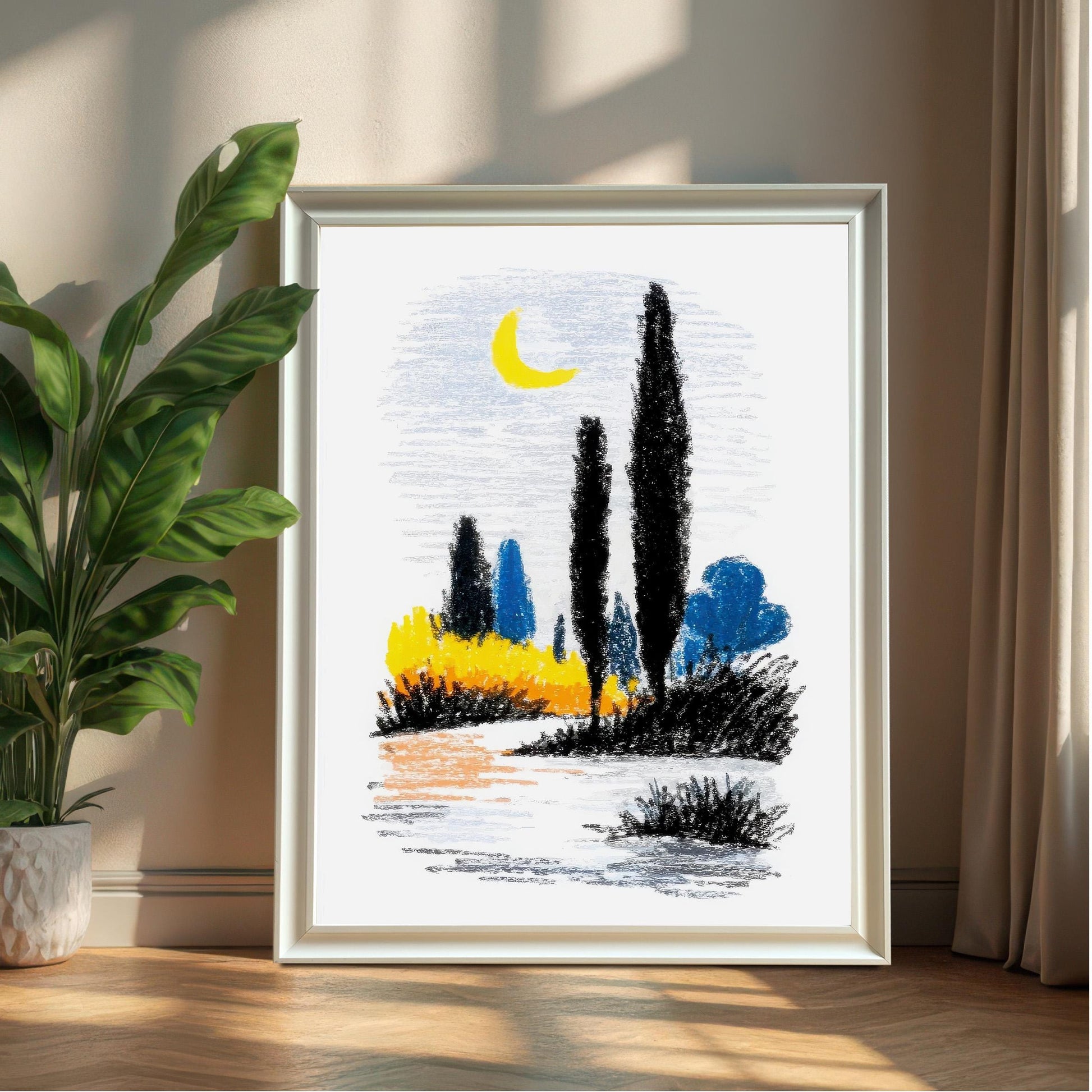 A large, framed abstract landscape print in a simple white frame, leaning against a neutral wall next to a potted green plant.