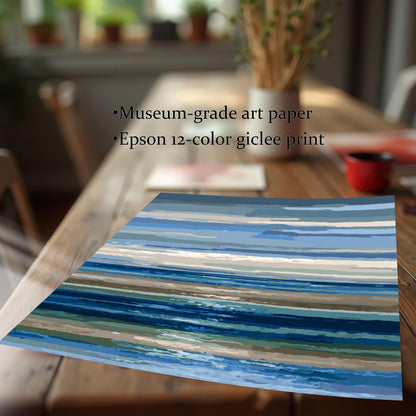 Close-up of the abstract blue and brown striped seascape giclée print resting on a wooden table. Text highlights: ""Museum-grade art paper,"" ""Epson 12-color giclée print.""