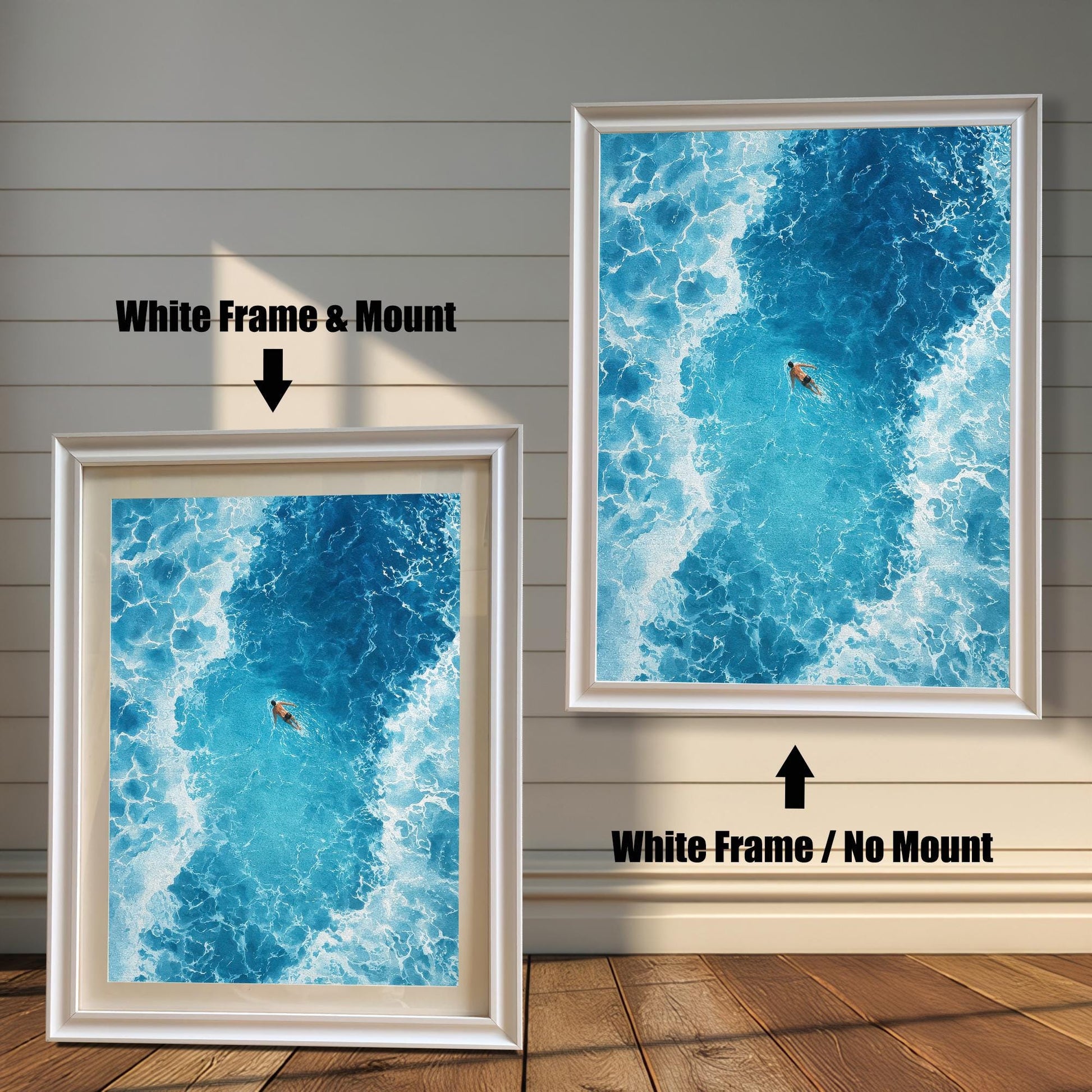 Comparison of the ocean art print with a White frame. The image on the left has a 'Mount' (mat board) and is leaning against the wall. The image on the right is hanging and has 'No Mount'. Both have a white wood frame.