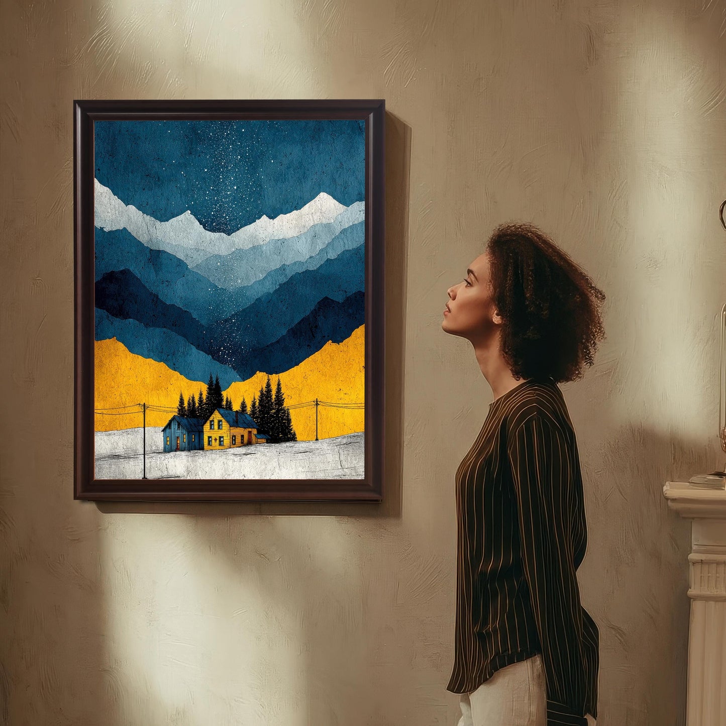 A woman in a striped shirt stands in a sunlit room, looking up at the art print mounted on a textured wall. The frame is a dark, Coffee (or brown) color.