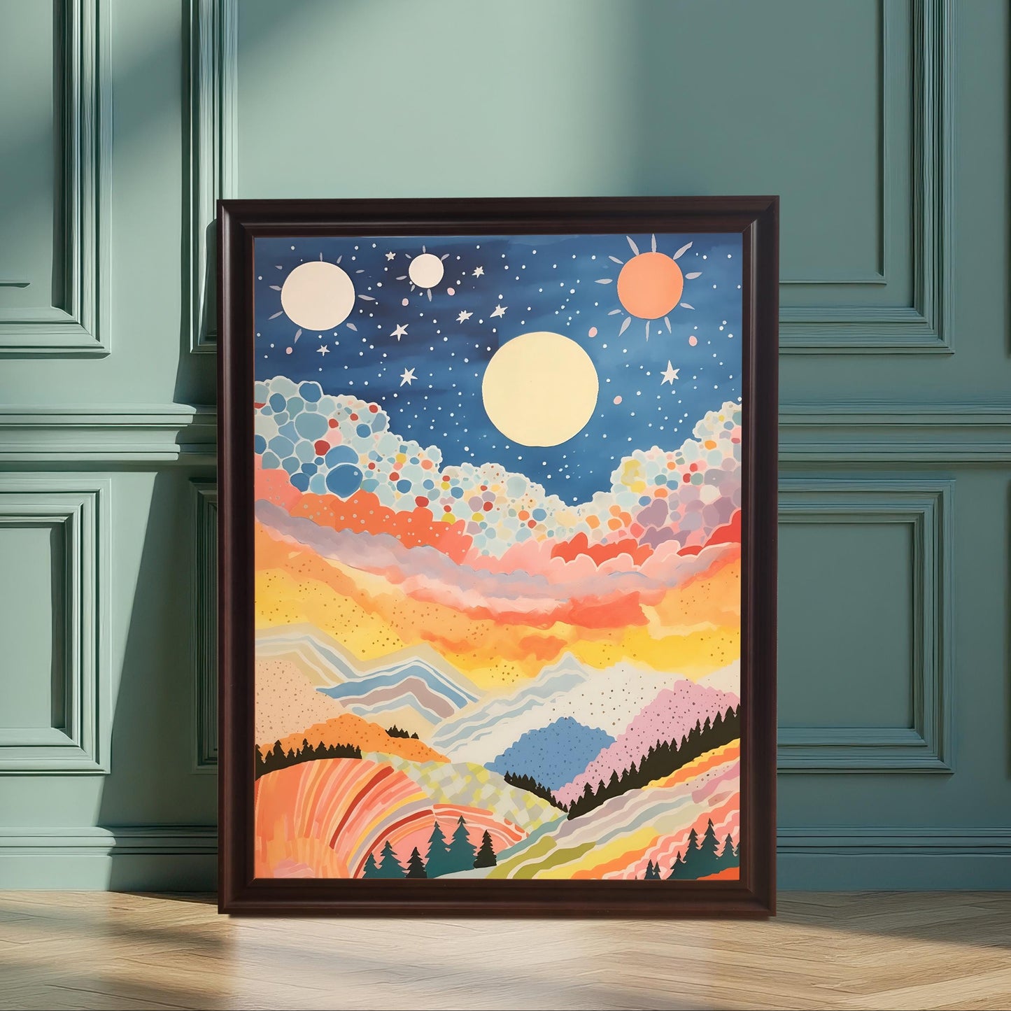 A full-size abstract, colorful celestial mountain landscape art print in a dark brown/black frame, leaning against a decorative teal/green wainscoted wall. The artwork features a starry blue sky, bright orange/yellow sunset clouds, and rolling hills.
