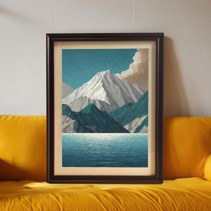 The mountain and lake art print in a dark brown/coffee frame with a mount/mat, positioned centrally on a bright, vibrant yellow sofa or cushion.