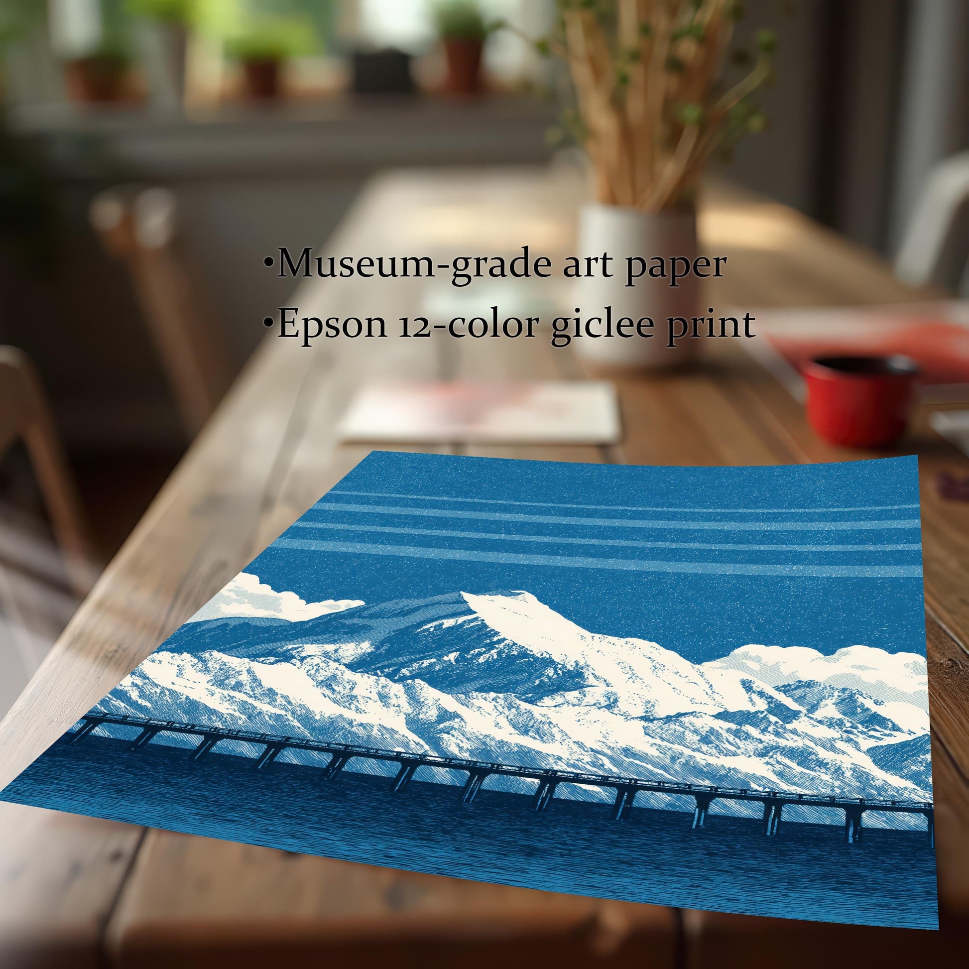 A close-up shot of the blue mountain and bridge art print lying on a wooden table. Text overlays highlight the quality: Museum-grade art paper and Epson 12-color giclee print.