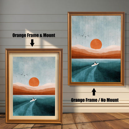 Comparison image showing the Orange wood frame options: on the left, a framed print with a mount/mat; on the right, the same print in an orange frame with no mount. Both on a paneled wooden wall background.