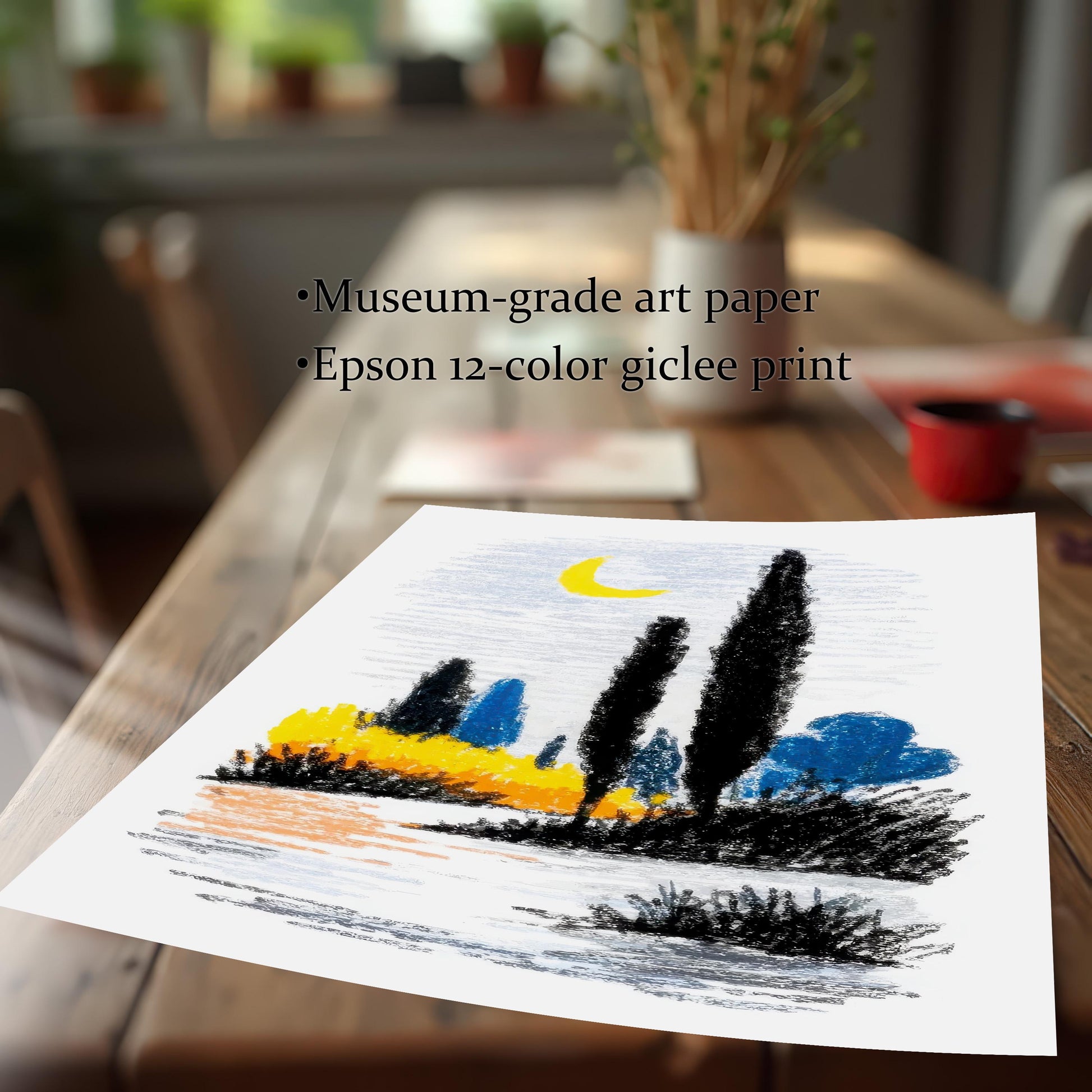 A close-up, angled view of the abstract landscape print itself (unframed), lying on a dark wooden table. The art is styled like a crayon or oil pastel drawing with black, yellow, and blue colors, under a crescent moon. Text highlights the quality: Museum-grade art paper and Epson 12-color giclee print.